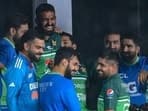 Virat Kohli meets players from the Pakistan team during last year's Asia Cup. 