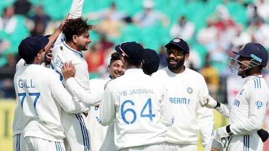 Kuldeep Yadav shows the match ball after taking his fifth wicket of the innings, dismissing England captain Ben Stokes on a duck.