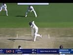 Shubman Gill charges down he track to hit Anderson for a six