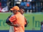 India's coach Rahul Dravid with R Ashwin after the team won the fifth Test cricket match over England