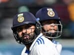 India's captain Rohit Sharma (L) and Yashasvi Jaiswal run between the wickets during the first day of the fifth Test cricket match between India and England at the Himachal Pradesh Cricket Association Stadium in Dharamsala on March 7