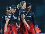 Royal Challengers Bangalore Women's (RCBW) Ellyse Perry and teammates celebrate a dismissal of Mumbai Indians Women (MIW) during their match in the Women's Premier League 2024
