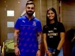 Shreyanka Patil (R) poses with Virat Kohli during the RCB UnBox event on Tuesday