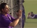 Shah Rukh Khan (L), the KKR co-owner, applauds Ramandeep Singh after the latter's brilliant catch against LSG