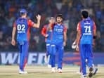 Delhi Capitals' Rasikh Dar Salam and teammates celebrate the dismissal of Gujarat Titans' Shahrukh Khan in the Indian Premier League 2024