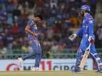 Mayank Yadav (L) in pain right after dismissing Mohammad Nabi during LSG's match against MI