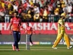 Punjab Kings' Harshal Patel, left, celebrates the wicket of Chennai Super Kings' MS Dhoni, right, during the Indian Premier League cricket match between Chennai Super Kings and Punjab Kings in Dharamshala, India, Sunday