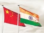 China India national flag cloth fabric waving on the sky with beautiful sun light - Image (Shutterstock)