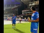 Rohit Sharma talks to Tilak Varma during an MI training session