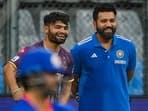 Rohit Sharma (R) with Rinku Singh during an IPL practice session 