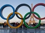 FILE - The Olympic rings are set up at Trocadero plaza that overlooks the Eiffel Tower, a day after the official announcement that the 2024 Summer Olympic Games will be in the French capital, in Paris.