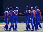 India players celebrate a catch during an exhibition cricket match between Bangladesh and India at the Nassau County International Cricket Stadium