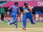 India's captain Rohit Sharma, right, and partner Virat Kohli run between wickets