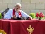 Modi inscribes his thoughts in Visitors' Book at the National War Memorial in New Delhi.