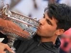 Spain's Carlos Alcaraz kisses the trophy after winning the men's final of the French Open tennis tournament against Germany's Alexander Zverev at the Roland Garros stadium in Paris, France, Sunday, June 9