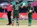 Bangladesh's Tawhid Hridoy, right, celebrates with batting partner Mahmudullah Riyad