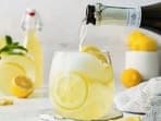 Pour out a glass of Limoncello spritz on a hot day