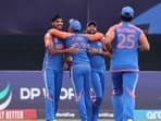 Arshdeep Singh and Mohammed Siraj of India celebrates the wicket of Nitish Kumar of the USA during the ICC Men's T20 Cricket World Cup