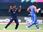 USA's Saurabh Netravalkar celebrates the dismissal of India's captain Rohit Sharma 