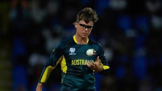 Australia's Adam Zampa tosses a ball while bowling against Namibia during an ICC Men's T20 World Cup cricket match at Sir Vivian Richards Stadium in North Sound, Antigua and Barbuda