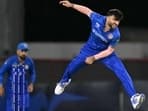 Afghanistan's Fazalhaq Farooqi bowls during the ICC men's Twenty20 World Cup 2024 group C cricket match between the West Indies and Afghanistan at Daren Sammy Cricket Ground 