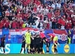 Albania players celebrate after teammate Albania's Klaus Gjasula scored their side's second goal during a Group B match between Croatia and Albania at the Euro 2024 soccer tournament in Hamburg, Germany, Wednesday