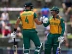 South Africa's captain Aiden Markram, left, and Quinton de Kock celebrate the partnership of 100 runs