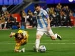 Argentina's Lionel Messi (10) lines up a shot, as he gets past Canada's goalkeeper Maxime Crépeau (16) during the second half of a Copa América match