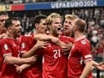 Denmark players celebrating after scoring the goal against England.