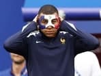 France's forward Kylian Mbappe dons a face mask after injuring his nose in the UEFA Euro 2024 match against Austria.