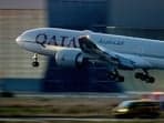 A woman bagged a business class seat on a Qatar Airways flight after running into the CEO of the airline.