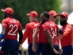 Latest news on June 23, 2024: England's Chris Jordan, third right without cap, celebrates with teammates after getting a hat-trick by dismissing United States' Saurabh Netralvakar