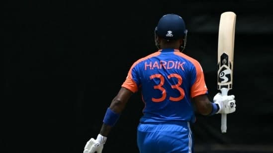 India's Hardik Pandya celebrates his half century on the last ball of India's turn during the ICC men's Twenty20 World Cup 2024 Super Eight cricket match between India and Bangladesh 