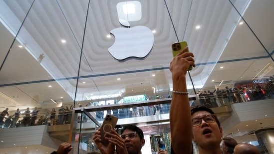 Customers cheer as they enter Apple Inc.'s store during its opening in Kuala Lumpur, Malaysia, on Saturday, June 22, 2024. 