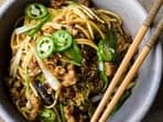 A picture of the savoury and delicious scallion noodles with pork. 