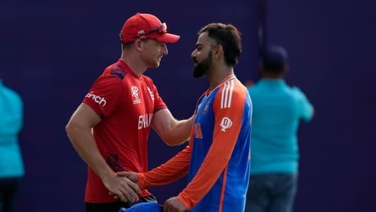 India's Virat Kohli, right, shake hands with England's captain Jos Buttler at the end of the ICC Men's T20 World Cup second semifinal