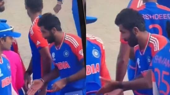 Jasprit Bumrah approaches the umpire for a handshake.