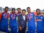BCCI Secretary Jay Shah, India's head coach Rahul Dravid and other team members pose for a picture as they celebrate after beating South Africa by 7 runs 