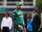 Pakistan's captain Babar Azam waits for the coin toss before the beginning of the ICC Men's T20 World Cup cricket match between Ireland and Pakistan