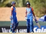 India Women's captain Harmanpreet Kaur and teammate Richa Ghosh celebrate their partnership during the Group A match against United Arab Emirates Women