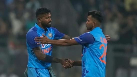 Shivam Mavi (R) is congratulated by Hardik Pandya.