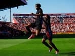 FC Barcelona's Lamine Yamal celebrates scoring their first goal with Jules Kounde.