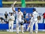 Kamindu Mendis (C) celebrates with Kusal Mendis after scoring a century during the first day of the first Test cricket match between Sri Lanka and New Zealand.