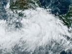 This National Oceanic and Atmospheric Administration satellite image shows Hurricane John near southern Mexico. Mexico travel alert: Deadly Hurricane John strikes southern Pacific coast with 'life-threatening' flood potential 