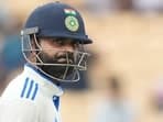 Virat Kohli reacts as he leaves the field after losing his wicket on the second day of the first cricket test match between India and Bangladesh, in Chennai.