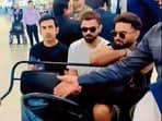 Gautam Gambhir (L), Virat Kohli (C), and Rishabh Pant taking a buggy ride