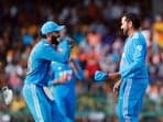 India's captain Rohit Sharma and Virat Kohli celebrate a wicket during the 2nd ODI match against Sri Lanka