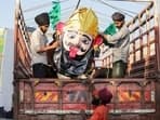 Amritsar, Oct 11 (ANI): People load an effigy of Ravana on a pickup truck on the eve of the Dussehra festival, in Amritsar on Friday. (ANI Photo)