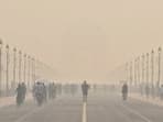 New Delhi, Oct 25 (ANI): Morning walkers, joggers and cyclists exercise on the Kartavya Path near India Gate amid deteriorating air quality in the city, in New Delhi on Sunday. (ANI Photo)