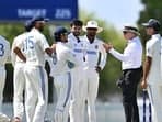 Ishan Kishan and other India A players in conversation with umpire